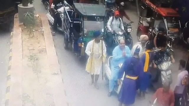 <div class="paragraphs"><p>A screengrab of&nbsp;CCTV footage showing the assailants stopping his scooter on a busy road</p></div>